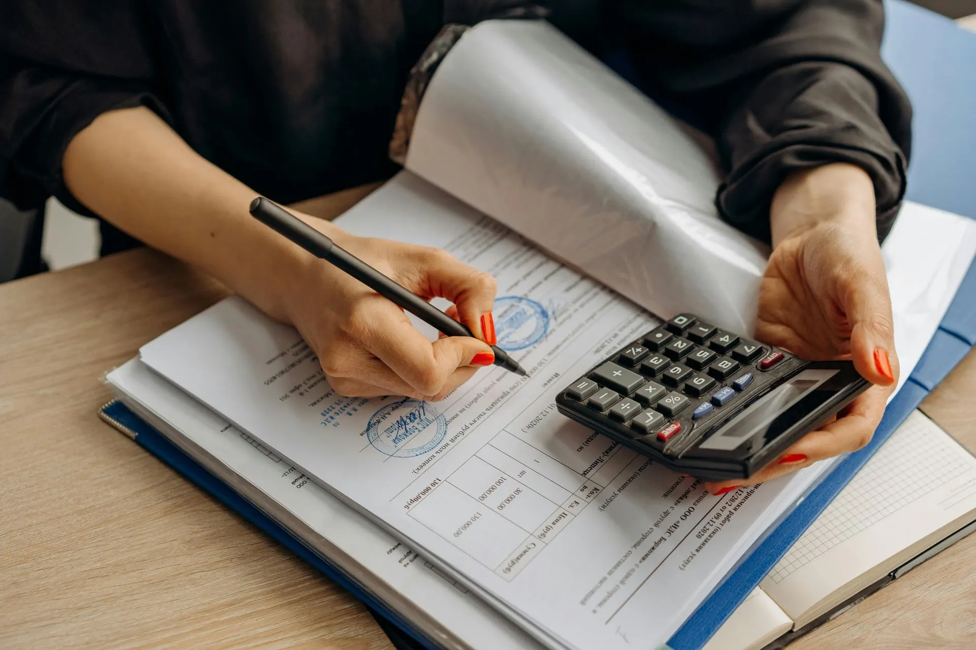 Bookkeeper organizing business financial records